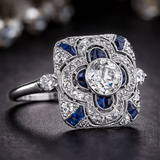 Anello retrò con brillanti blu | Oro bianco