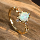 Anello artigianale con pietra preziosa opale d'oro | Oro