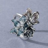 Anello con fiore esotico | Oro bianco