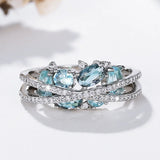 Anello con croce e pietra preziosa blu | Oro bianco