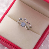 Anello regolabile con pietra blu | Oro bianco