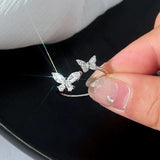 Anello regolabile con una farfalla splendente | Oro bianco