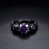 Anello rotondo retro nero con pietra preziosa viola e design complesso | Oro