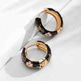 Bijoux fiori neri di lusso | Oro