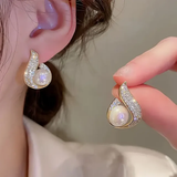 Orecchini con brillanti e perle lucenti | Oro