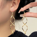 Orecchini pendenti a spirale | Oro