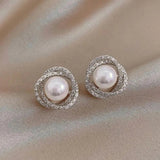 Orecchini a spirale brillanti con eleganti perle | Oro