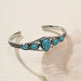 Bracciale aperto a forma di goccia d'acqua turchese | Oro bianco