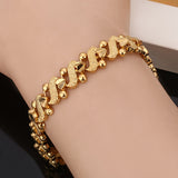 Bracciale a onde ornato di gigli | Oro