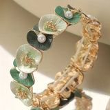 Braccialetto vintage con fiori verdi e margherite | Oro