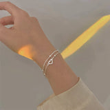 Bracciale regolabile con cuore | Oro bianco