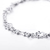 Bracciale con zampe di cane sospese e Osso Grezzo, Edizione limitata | Oro bianco