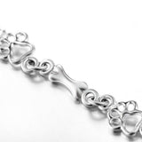Bracciale con zampe di cane sospese e Osso Grezzo, Edizione limitata | Oro bianco