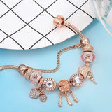Bracciale sognatore rosa con pendenti | Oro bianco