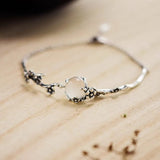 Bracciale rétro con ramo di fiore | Oro bianco