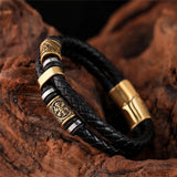 Bracciale in pelle nera intrecciata con pendente | Oro