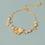 Bracciale classico con foglie di ginkgo e margherite | Oro