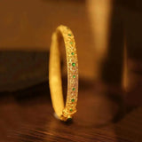 Bracciale in stile bangle con pietre preziose | Oro