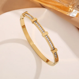Bracciale geometrico aperto con due file di brillanti | Oro