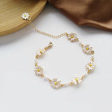 Bracciale retrò con margherite e fiori bianchi | Oro