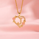 Collana iniziale con charm floreale | Oro