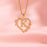 Collana iniziale con charm floreale | Oro