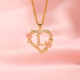 Collana iniziale con charm floreale | Oro
