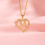 Collana iniziale con charm floreale | Oro