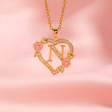 Collana iniziale con charm floreale | Oro