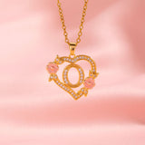 Collana iniziale con charm floreale | Oro