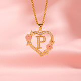 Collana iniziale con charm floreale | Oro