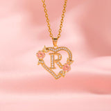Collana iniziale con charm floreale | Oro