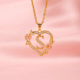 Collana iniziale con charm floreale | Oro