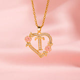 Collana iniziale con charm floreale | Oro