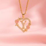Collana iniziale con charm floreale | Oro