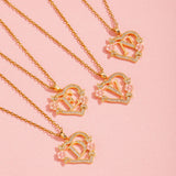 Collana iniziale con charm floreale | Oro