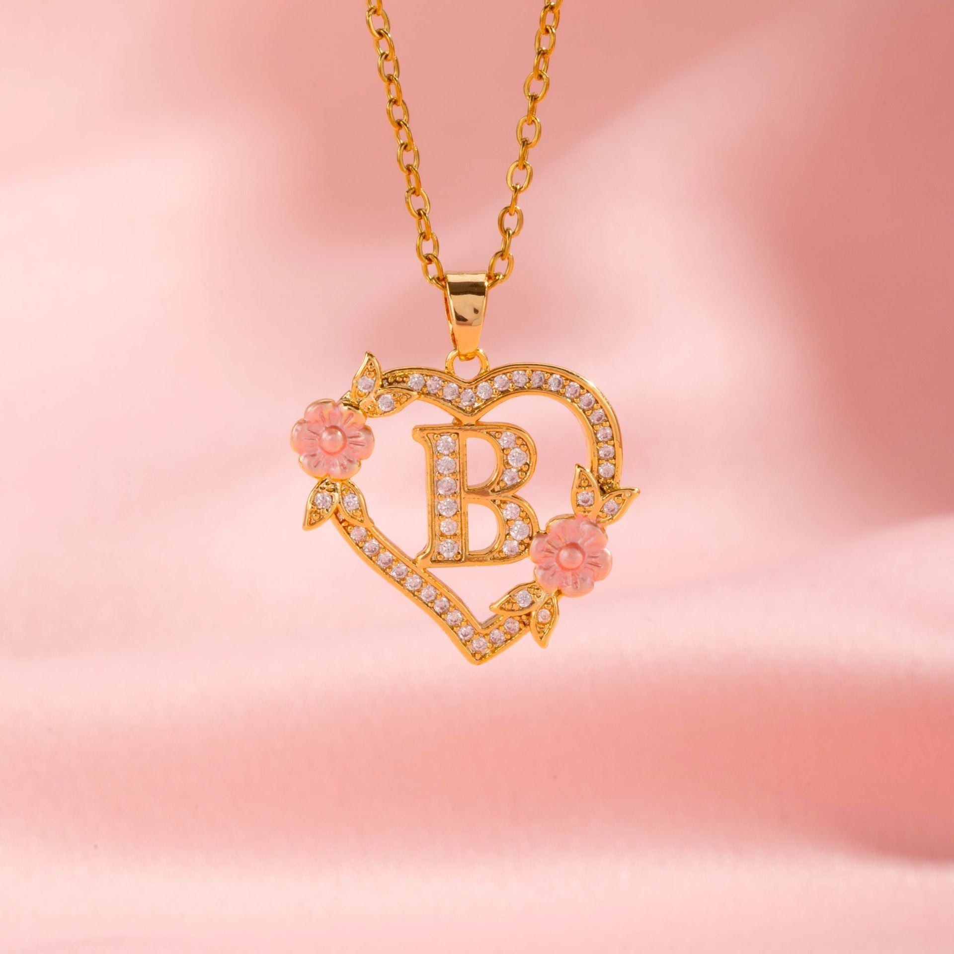 Collana iniziale con charm floreale | Oro