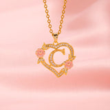 Collana iniziale con charm floreale | Oro