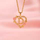 Collana iniziale con charm floreale | Oro