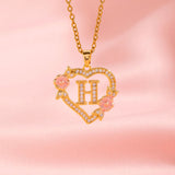 Collana iniziale con charm floreale | Oro