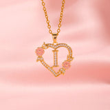 Collana iniziale con charm floreale | Oro