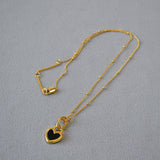Collana con pendente a cuore in bianco e nero | Oro