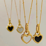 Collana con pendente a cuore in bianco e nero | Oro