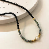 Collana con perle nere, oro e perle | Oro
