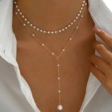 Collana di perle a due file con pendenti | Oro