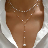 Collana di perle a due file con pendenti | Oro