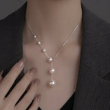 Collana elegante con perle sospese | Oro