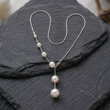Collana elegante con perle sospese | Oro
