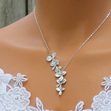 Collana e orecchini a forma di fiori | Oro bianco