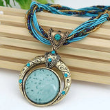 Collana rétro con pendente etnologico in cristallo verde | Oro